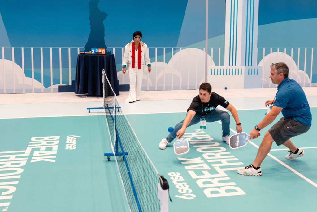 two people playing pickleball